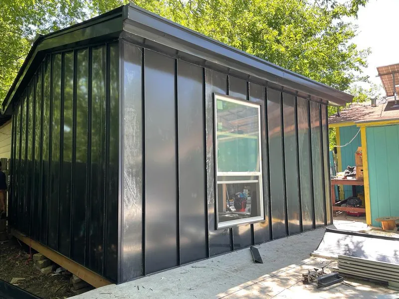 Black standing seam metal wall panels for Roof Inspection in Ennis