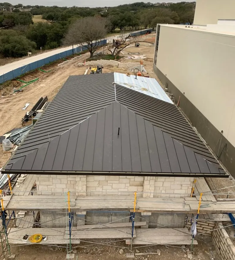 Metal roof new construction with scaffolding in Ennis