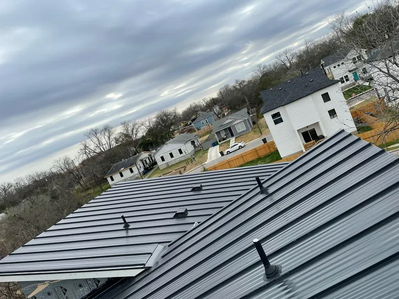 Standing seam metal roof panels with vents for Skylight Repair in Ennis